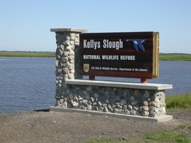 Kellys Slough sign by main pool